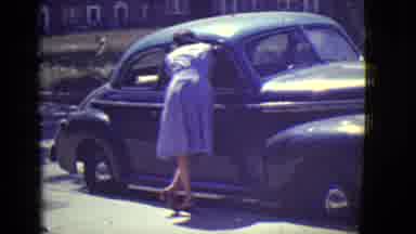 East Orange New Jersey (1946): Woman Leaning Into Car Window While Little Blonde