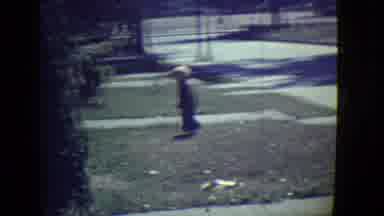 East Orange New Jersey (1946): Boy Walks Around His Front Lawn On A Sunny Day