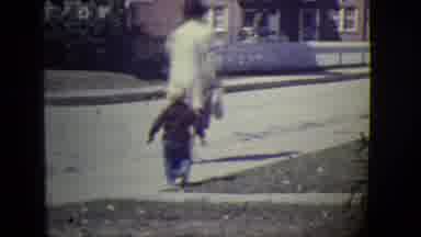 East Orange New Jersey (1946): Boy Plays In His Garden And With People Passing By