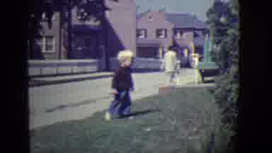 East Orange New Jersey (1946): Small Boy Walks And Runs On A Grass Verge, In Front