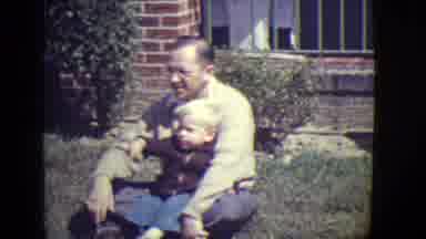 East Orange New Jersey (1946): Dad And A Child Play Outdoor In The Grass Of The