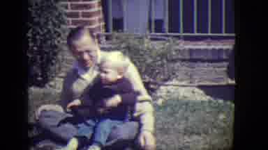 East Orange New Jersey (1946): Father Kissing Son In Front Of House