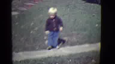 East Orange New Jersey (1946): A Blond Boy Walking Backwards In The Garden Of His