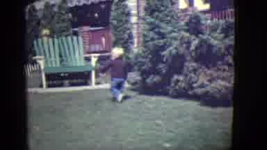 East Orange New Jersey (1946): Boy Wearing Blue Pants Climbs Onto Green Bench On A