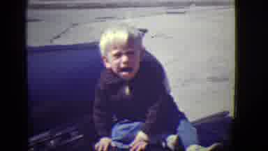 East Orange New Jersey (1946): A Small Child Sitting On The Hood Of A Car Smiling