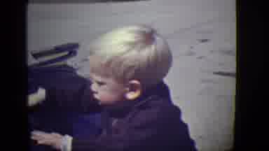 East Orange New Jersey (1946): Blond Boy Hitting A Large Object With His Hands And