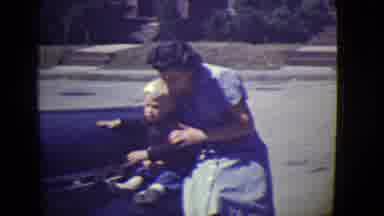 East Orange New Jersey (1946): Mother And Child Sit On Car Wave At Camera And