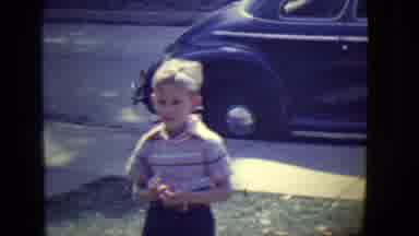 East Orange New Jersey (1946): Little Blond Boy Talking To Someone In Front Of A