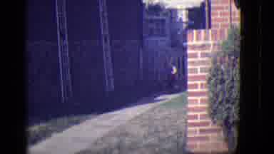 East Orange New Jersey (1946): Boy Riding Around Outside Down A Sidewalk On A