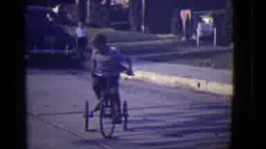 East Orange New Jersey (1946): Two Boys Ride Together Slowly On A Bike In A Circle