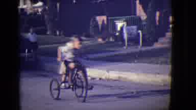 East Orange New Jersey (1946): Two Little Boys Ride A Tricycle Down A Neighborhood