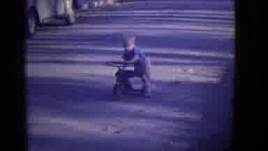 East Orange New Jersey (1946): Little Boy Pushing His Tricycle Up A Road As