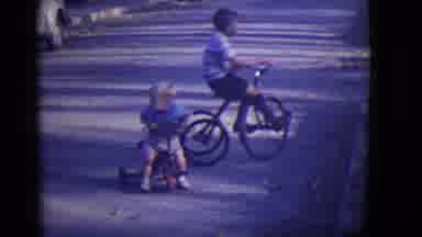 East Orange New Jersey (1946): A Young Boy Rides A Bike And A Toddler Plays On A
