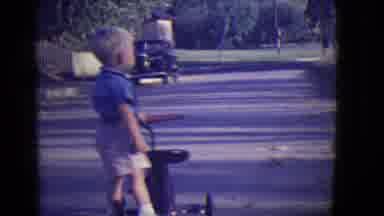 East Orange New Jersey (1946): A Little Boy Is Riding An Old Tricycle Outside In