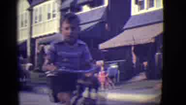 East Orange New Jersey (1946): An Older Child Riding A Push Bike Down A Street And
