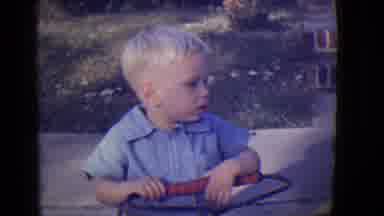 East Orange New Jersey (1946): A Little Boy Wearing A Blue Shirt Sitting On An