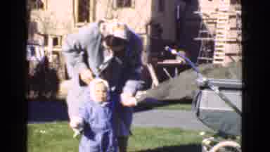 Quebec Canada (1946): Woman Helping Child Walk On Grass On A Sunny Day