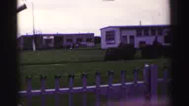 UNITED KINGDOM-1952: Tractor Pulling Mobile Home Across Grassy Field