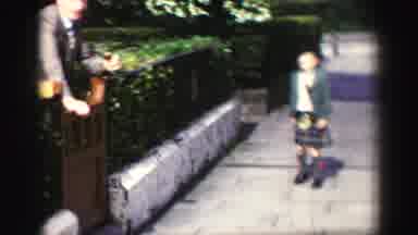 United Kingdom (1952): A Man Tells A Little Boy Wearing A Kilt To Run Towards The