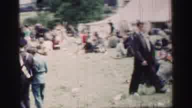 UNITED KINGDOM-1952: Panoramic View Of A Large Crowd Of People Sitting And Walking On A Grassy Hill