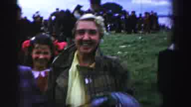 United Kingdom (1952): Smiling Young Women Watching A Celebration With Men In
