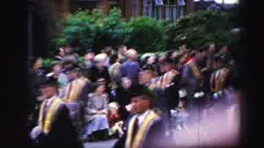 United Kingdom (1952): A Crowd Of People Is Watching A Parade And People Are