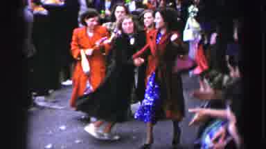United Kingdom (1952): Group Of Women Dancing In Street On A Clear Day