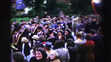 United Kingdom (1952): Many Happy People On The Street Watching A Marching Band