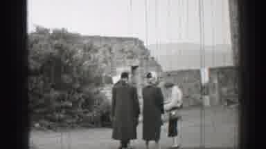 United Kingdom (1952): A Small Group Of Women Gather Around In The Courtyard Of A