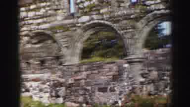 UNITED KINGDOM-1952: View Of Historic Ruins With Celtic Cross And Stone Walls