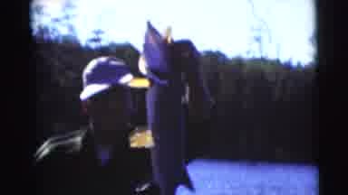 Baraboo Wisconsin USA (1953): Two Men Go Fishing And One Man Proudly Holds Up His