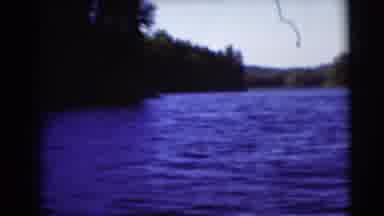 Baraboo Wisconsin USA (1953): Camera Pans Around A Lake In The Summer, Edged By
