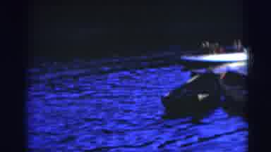 Baraboo Wisconsin USA (1953): Two Men Climb Into Row Boat On A Bright Sunny Day