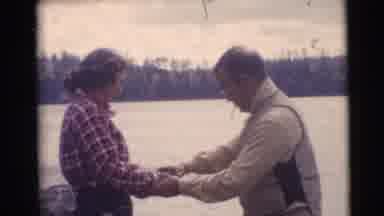 Baraboo Wisconsin USA (1953): Man Showing A Woman How To Fish In A Lake