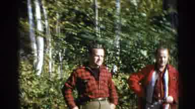 Baraboo Wisconsin USA (1953): Two Men Both Wearing Red Shirts Are Standing Outside