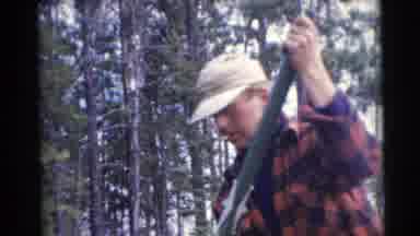 Baraboo Wisconsin USA (1953): Man Rowing A Boat With Another Man Holding A Rope