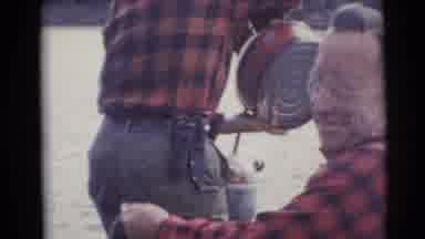 Baraboo Wisconsin USA (1953): Two Men Wearing Black And Red Shirts Fishing From A