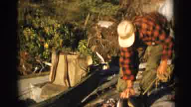 Baraboo Wisconsin USA (1953): Fisherman Arranges Caught Fish In Wooded Area Beside