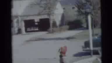 Baraboo Wisconsin USA (1953): Boy And Girl Play With Blanket Outside A House On A