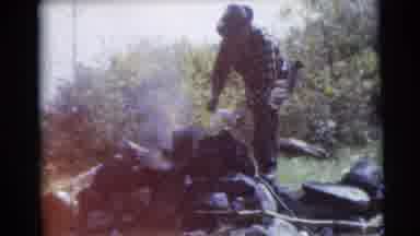 Baraboo Wisconsin USA (1953): Two Men Preparing Camp Site While Cooking And