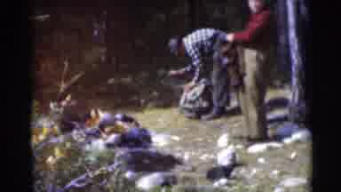 Baraboo Wisconsin USA (1953): Two Men Are Standing In Open Area Surrounded By