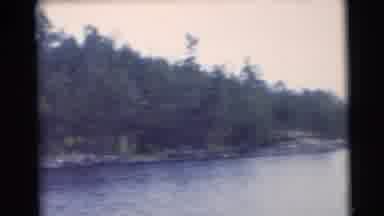 Baraboo Wisconsin USA (1953): Man Prepares To Go Out With A Canoe On A River That