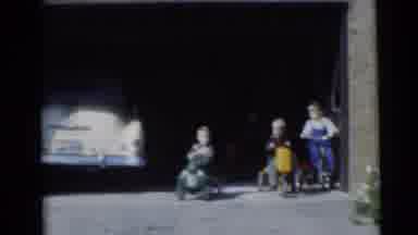 Baraboo Wisconsin USA (1953): Boys Racing Out Of The Driveway In Their Cars And
