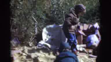 Miami Florida (1956): Three Children In Winter Gear Playing In A Pile Of Bricks