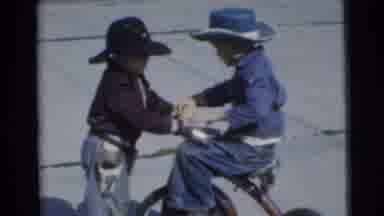 Miami Florida (1956): Two Little Boys Fighting Over A Bike While Dressed As