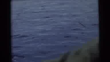 Miami Florida (1956): Men On Boat In A Lake Fishing And As Boat Moves He Is