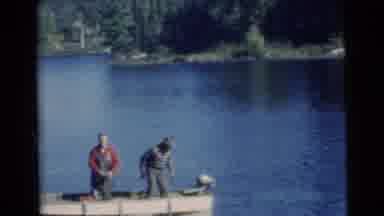 Miami Florida (1956): Two Men On Boat Throw Fish Into Water And Start Engine