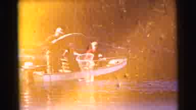 Miami Florida (1956): Three People Catch Fish On A Boat In The Lake