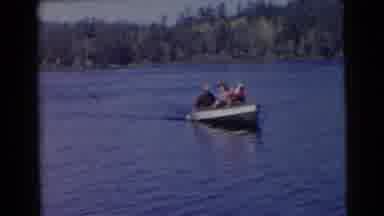 Miami Florida (1956): Three People In A Boat Sail Up To The Shore As One Turn Away