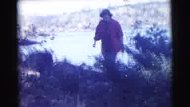 Miami Florida (1956): A Woman In Chequered Shirt Is Walking On Top Of Mountain